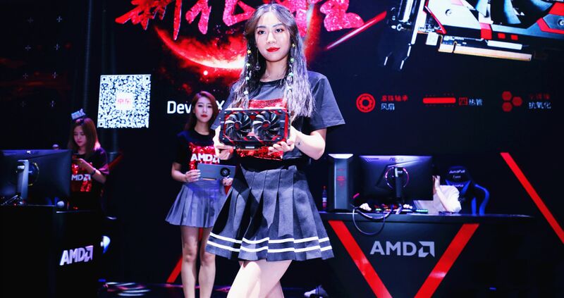 Qt woman holding amd gpu.jpg